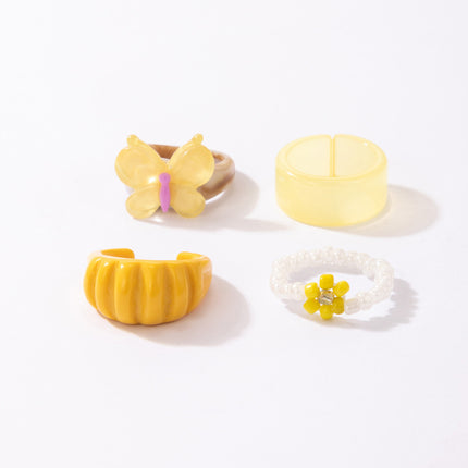 Reis-Perlen-Blumen-Breitgesichts-Acryl-Schmetterlingsring 4-teiliges Set