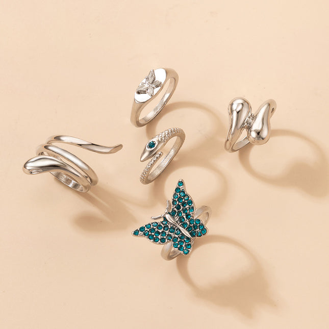 Anillos de diamantes de imitación de mariposa azul irregular serpentina cinco piezas