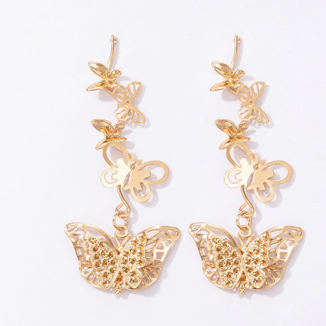 Lange Ohrringe aus schwerem Metall mit Schmetterling