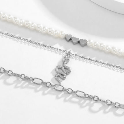 Strass-Schlangen-Schlüsselbein-Halskette Hirse-Perlen-Herz-Halskette