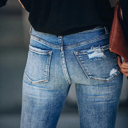 Jeans pitillo de mujer con botones desgastados lavados